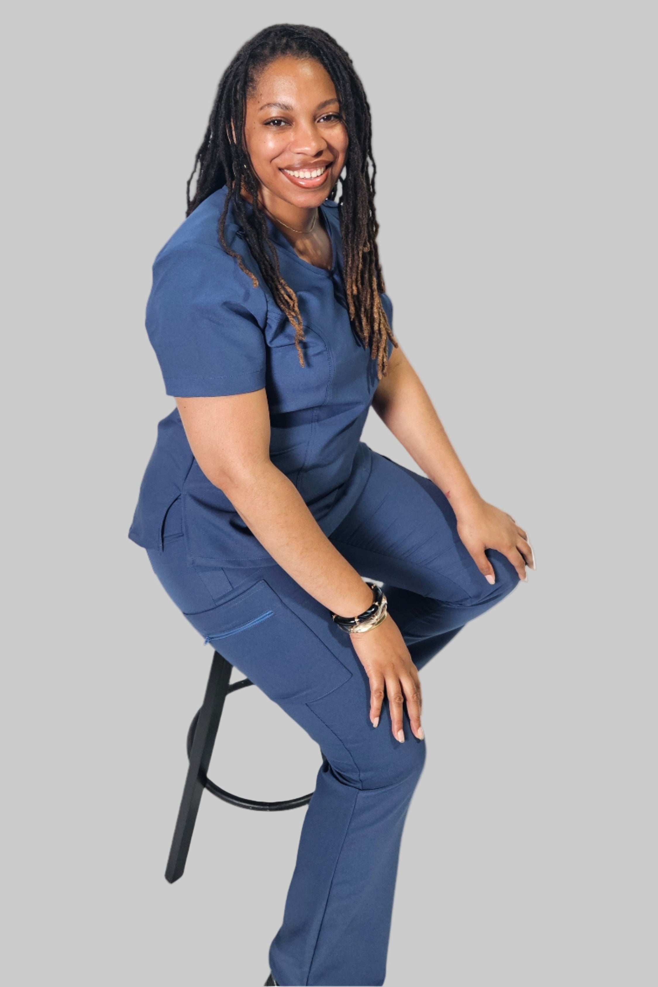 Matching True Blue scrub set featuring the Lexie Curvy Cargo Pants paired with a coordinating scrub top.
