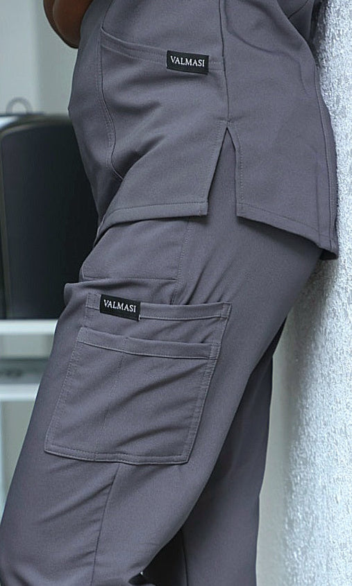 woman wearing grey scrubs over coffee