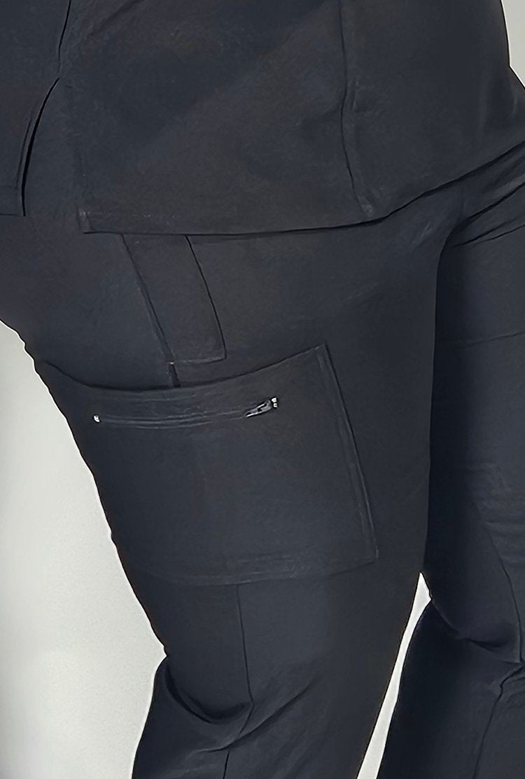 Close-up of zippered cargo pocket and stethoscope loop, showcasing function and craftsmanship.