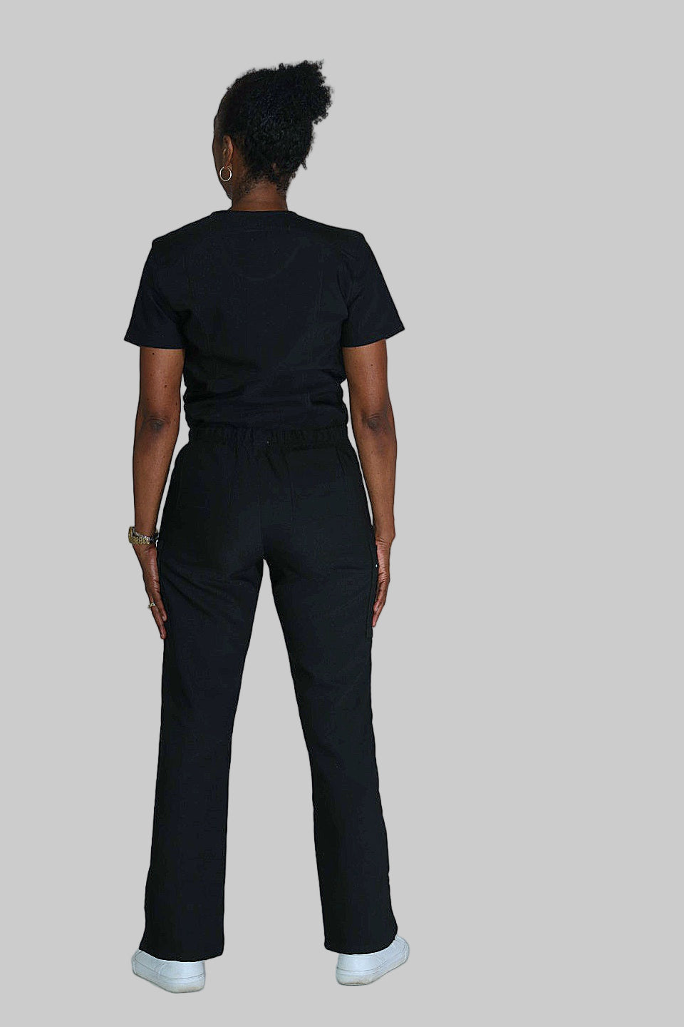 Back view of Valmasi Jasmine Cargo Scrub Pants with contoured waistband and sleek silhouette.