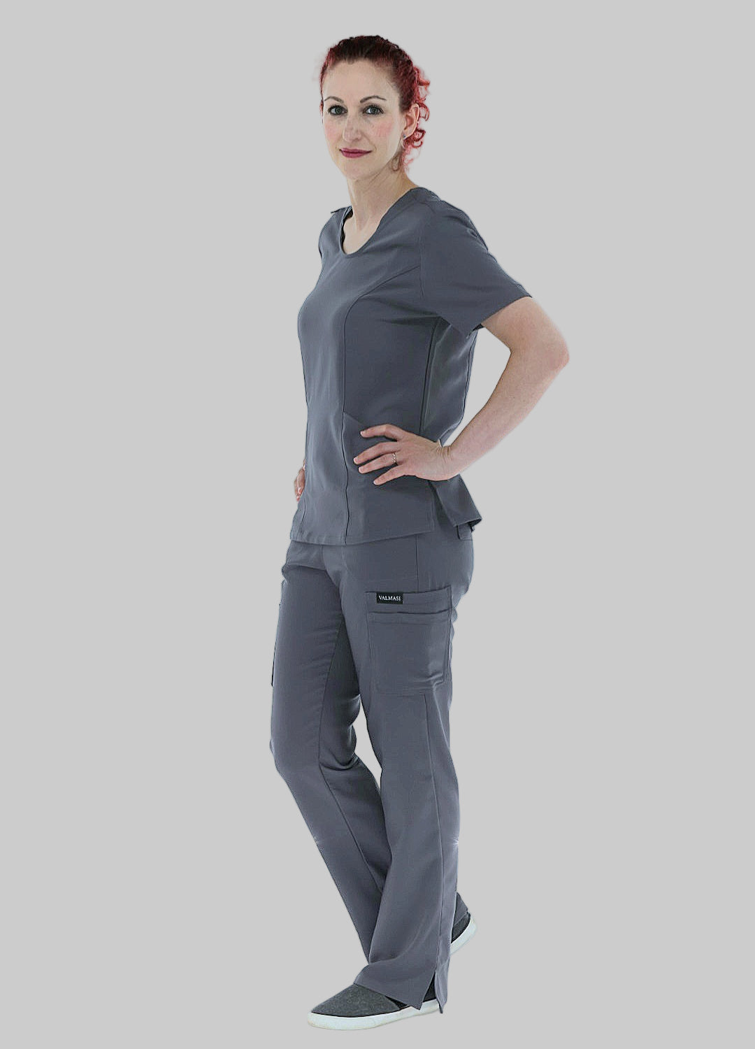 Professional grey scrub top with contoured seams, modern fit, and functional pockets.