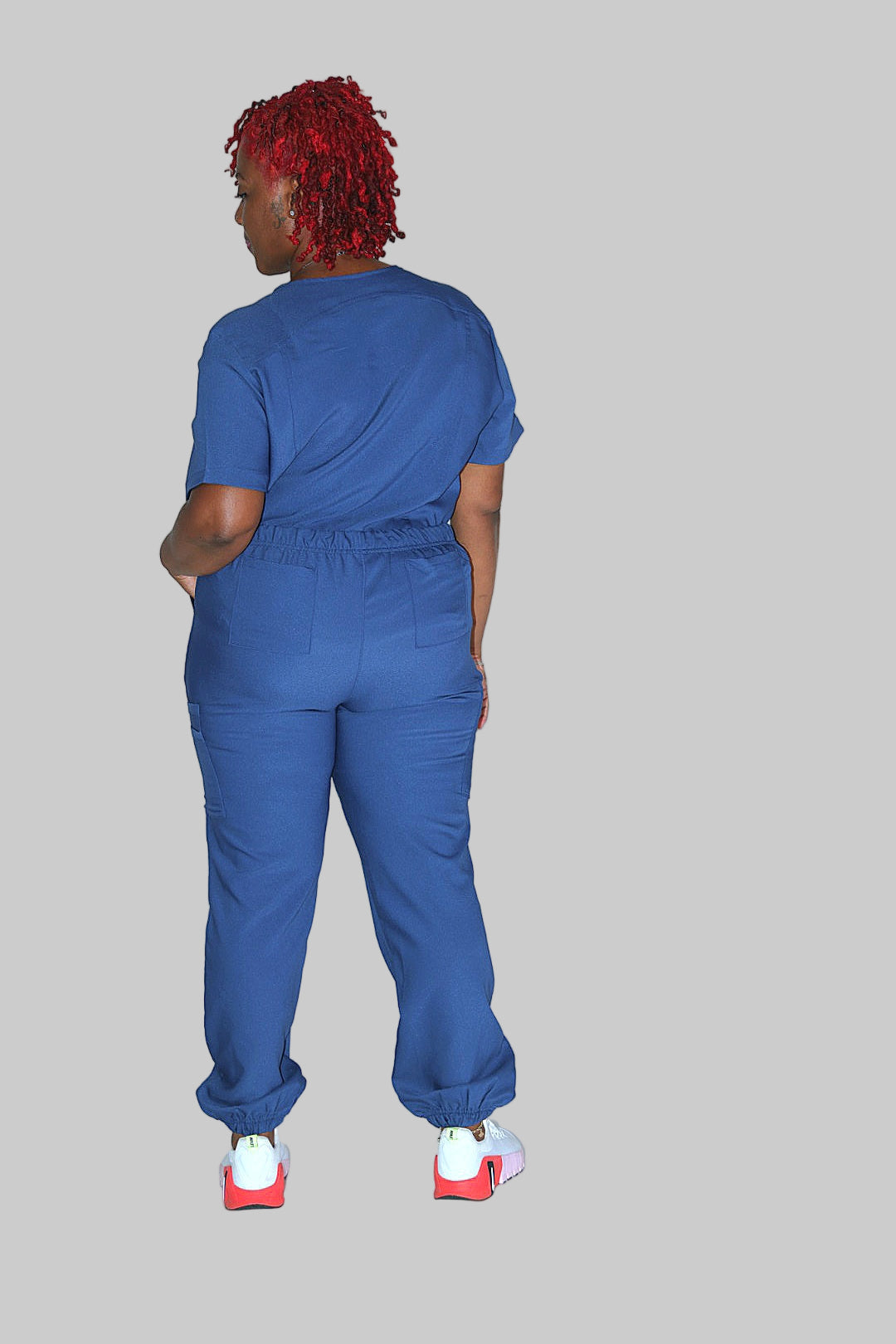 High-waisted blue scrub joggers with drawstring waist and tapered legs.