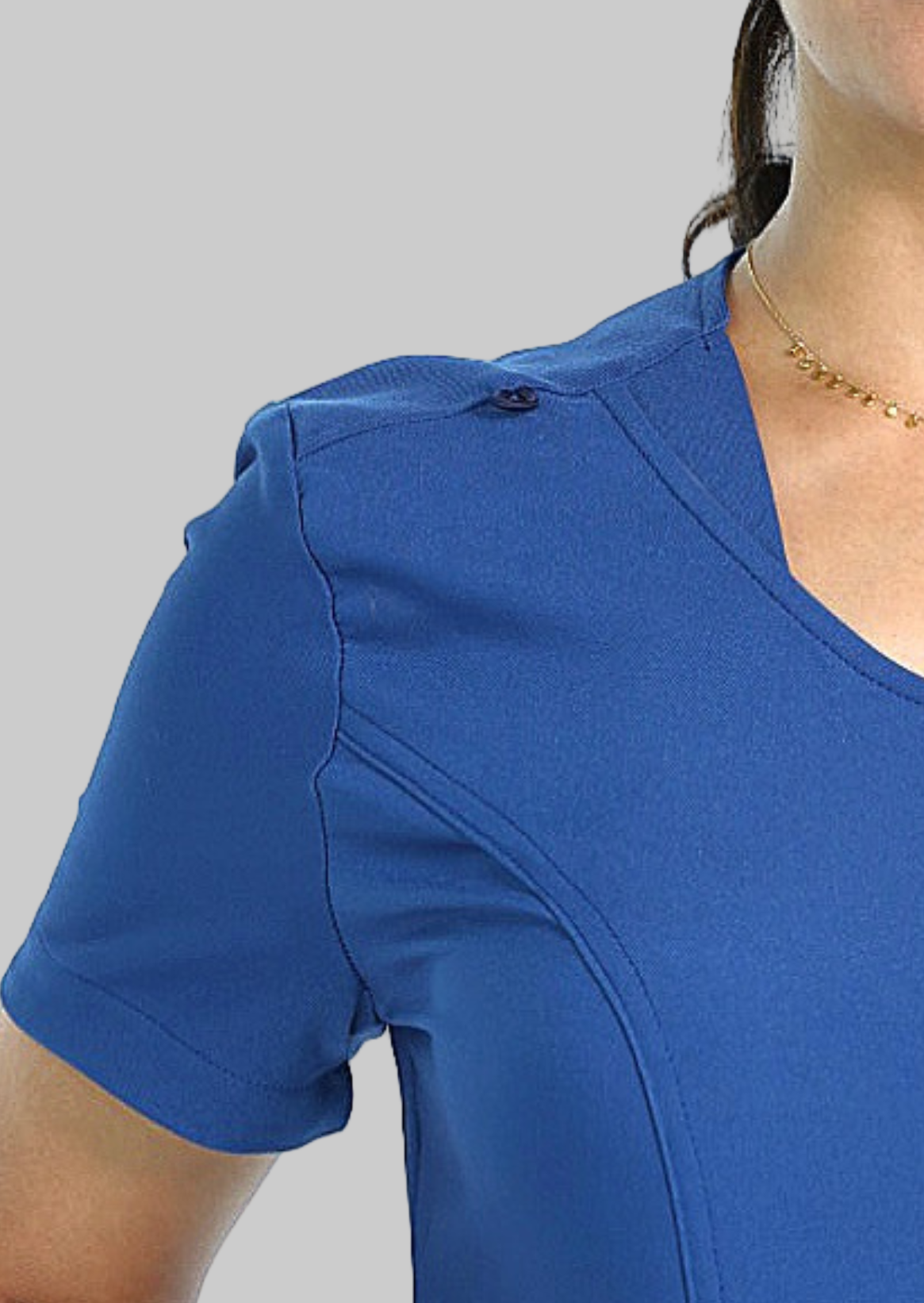 Quality blue scrub top with clean silhouette, V-neck, and dual front pockets.
