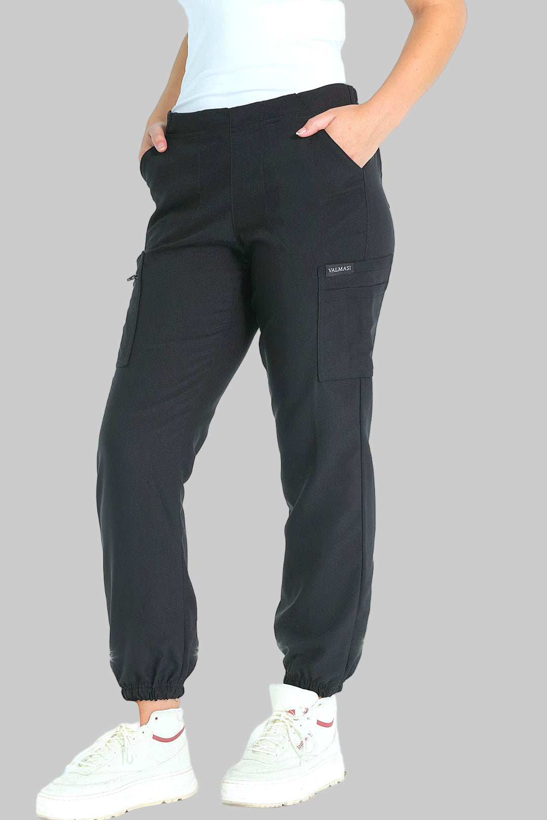 Side view showing the slim jogger fit, petite-friendly inseam, and sleek pocket placement for functionality and style.