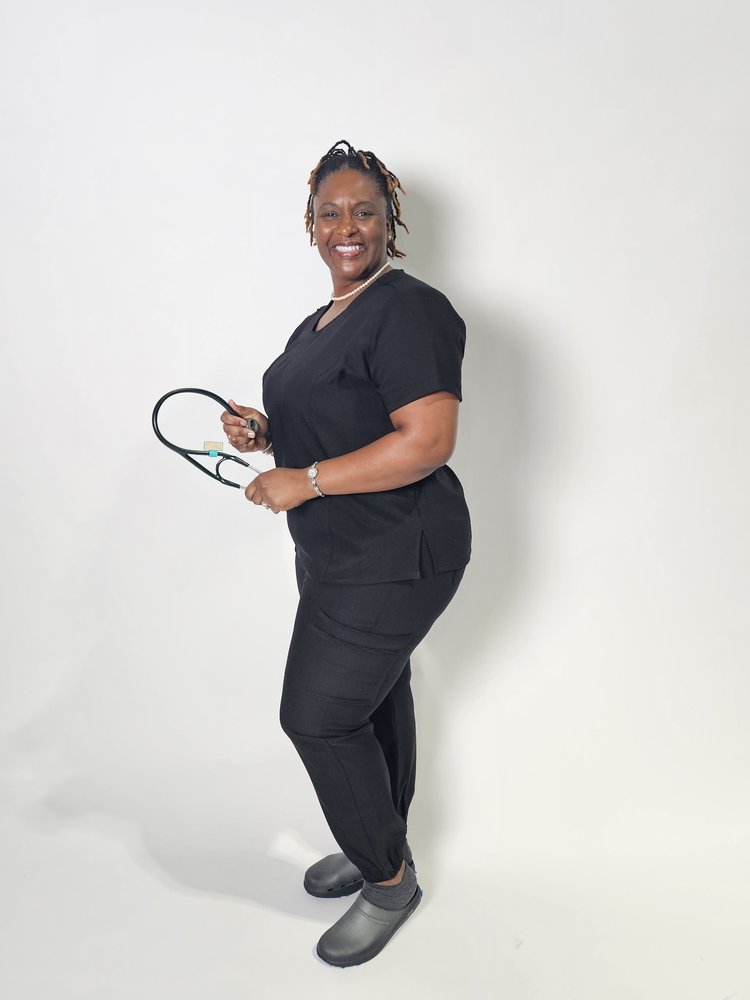 Female doctor in black curvy scrub top and joggers